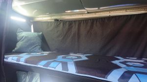 Primordial Radio Inkubus Camper - top bunk with bedding